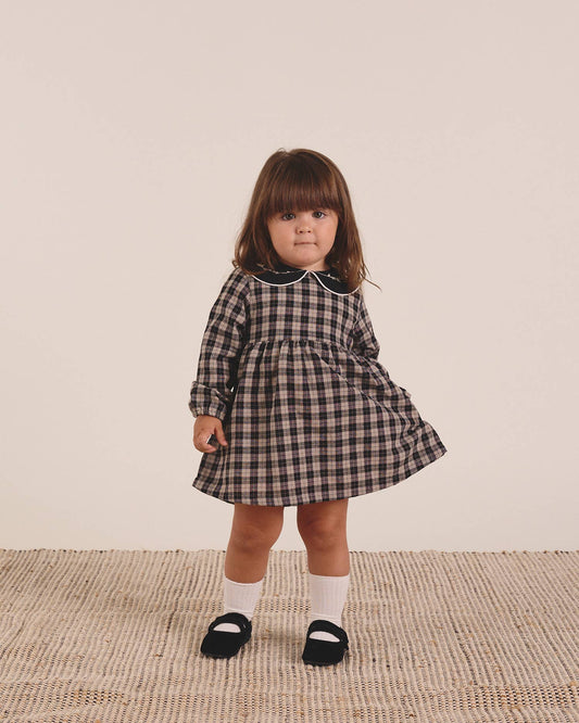 Robe pour bébé en beige clair et carreaux noirs