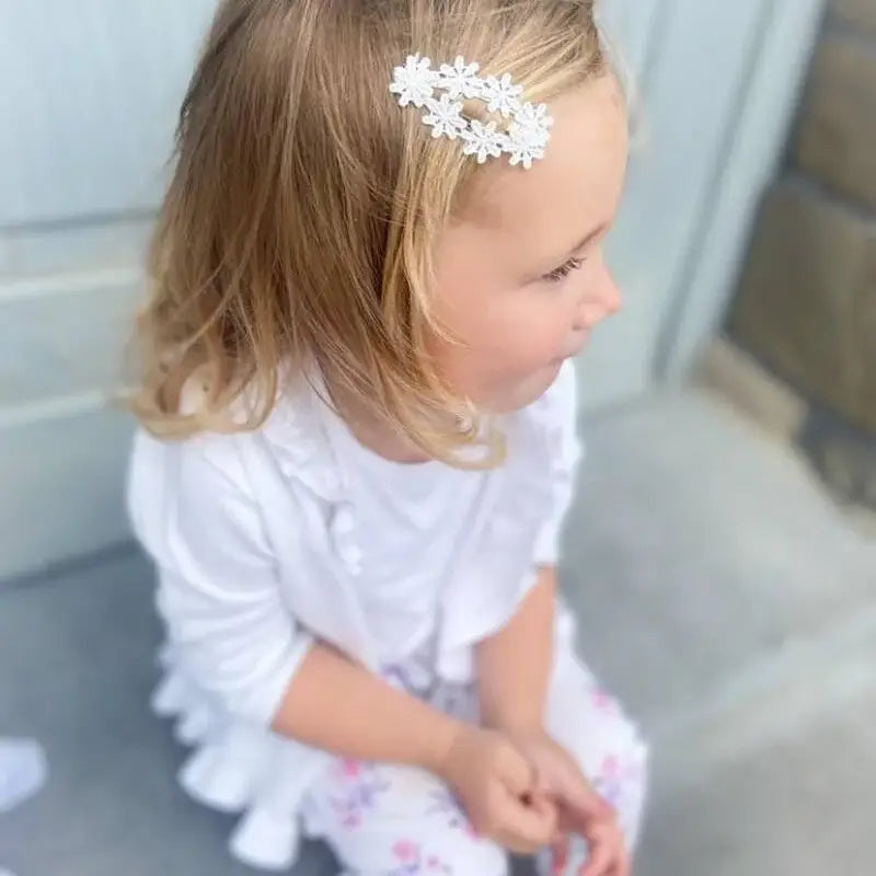 Barrettes fleurs blanches