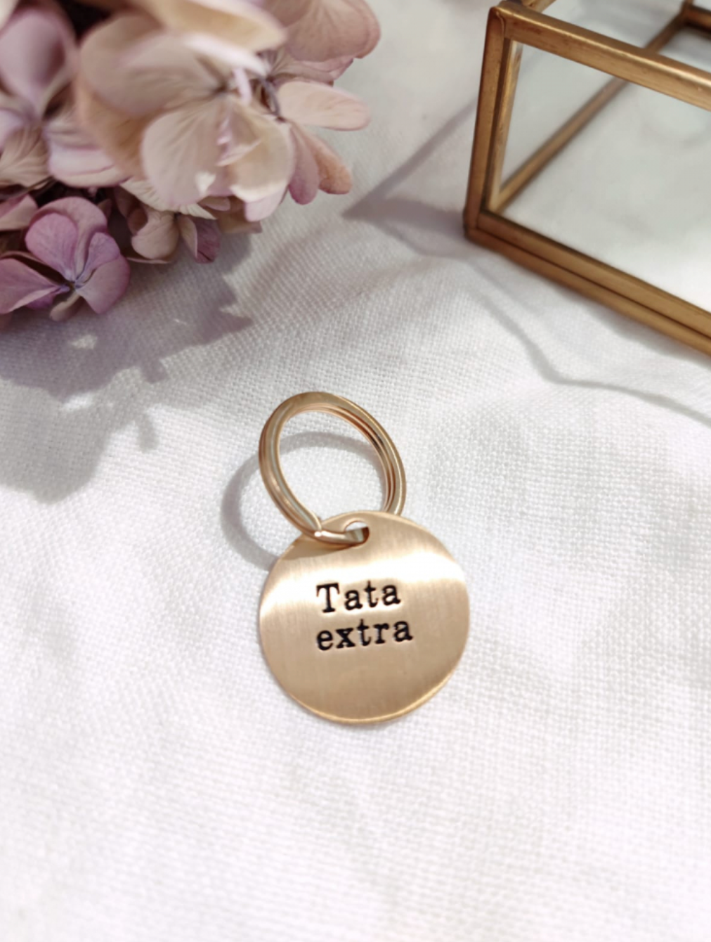 Porte clef "Tata extra" doré brossé