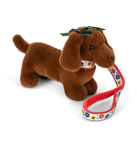 Petit teckel en peluche avec sa niche