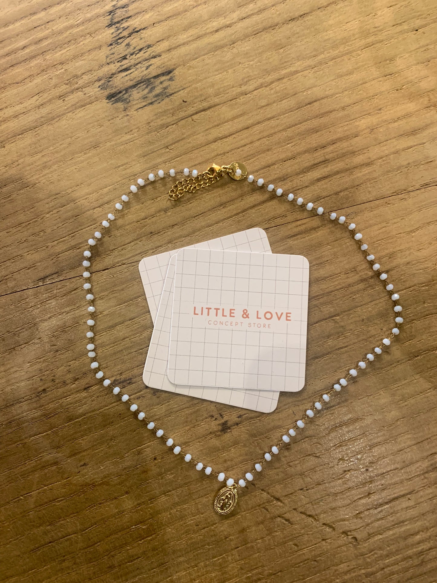 Collier boules blanches et Madone or